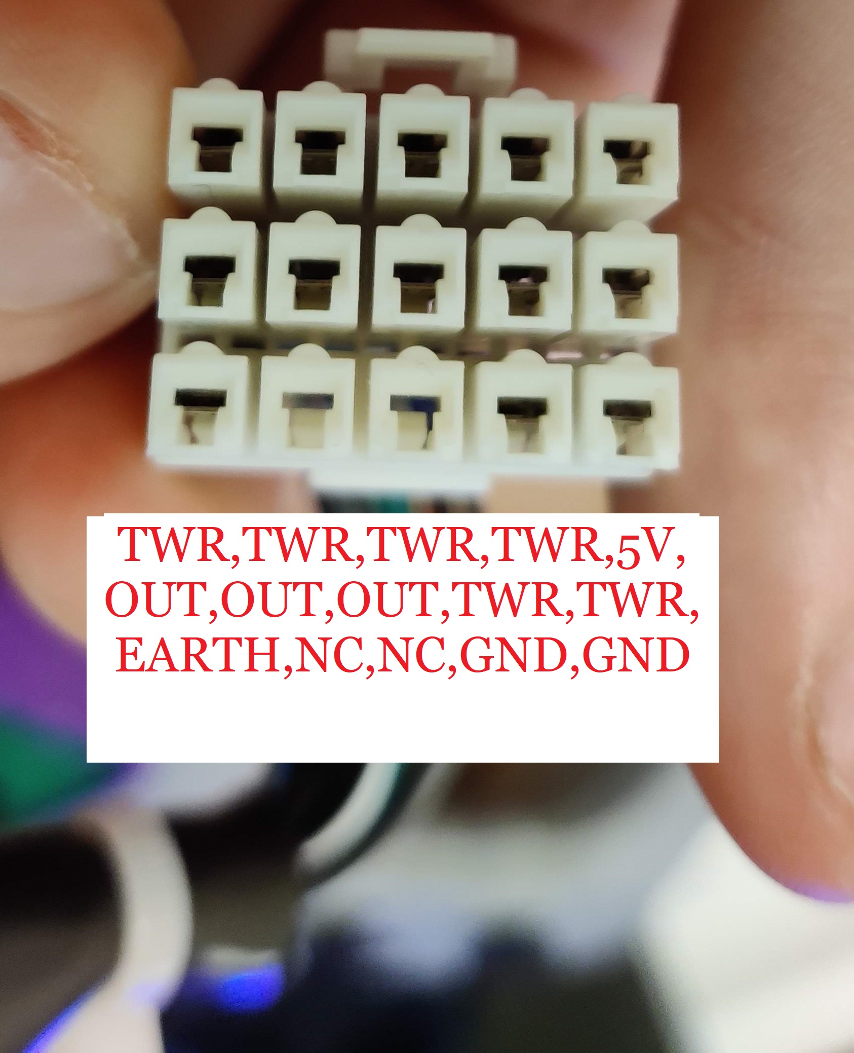 An image showing the sensor connector from a chunithm air string unit. The pinout is annotated, left to right, top to bottom, as so: 5V, TOWER, TOWER, TOWER, TOWER, TOWER, TOWER, OUTPUT, OUTPUT, OUTPUT, GND, GND, NC, EARTH. The pins marked 'tower' connect to the other air tower on the other side, so pin 2 -> pin 2, pin 3 -> pin 3 and so on. Outputs are where the state of the tower can be read from (order to be checked).