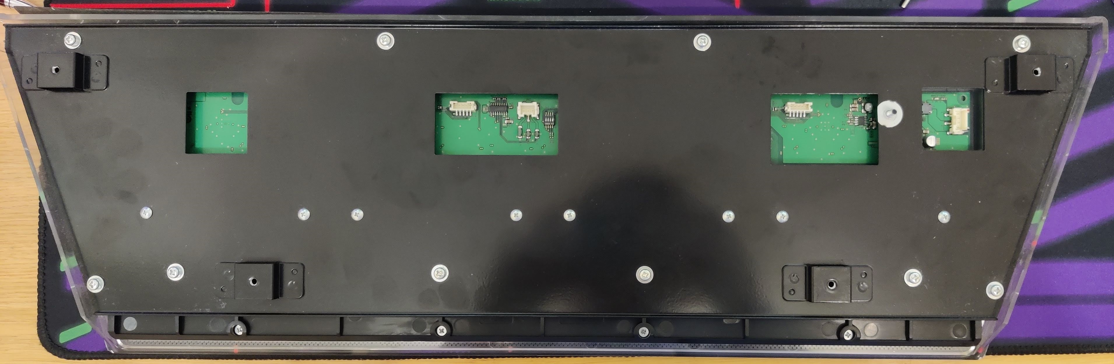 Back of an arcade Chunithm slider, showing the four connectors.