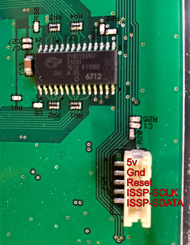 Image labelling the pins on one of the chunithm slider's programming ports. From top to bottom, the pins are 5v, ground, reset, issp-sclk and issp-sdata.