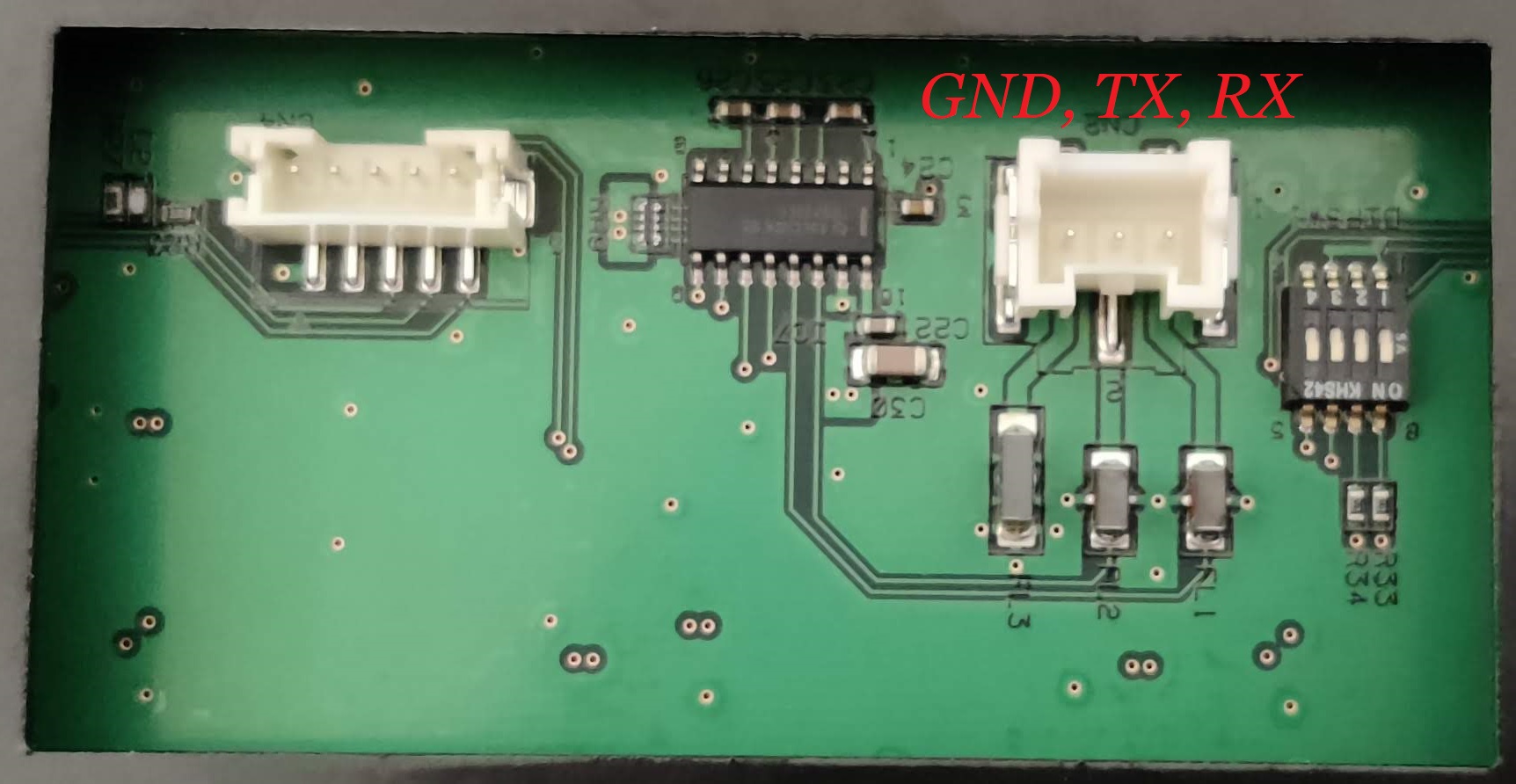 Image showing the two leftmost connectors on the chunithm arcade slider. The pinout of the right hand (serial) connector is annotated, left to right, as GND, TX, RX.